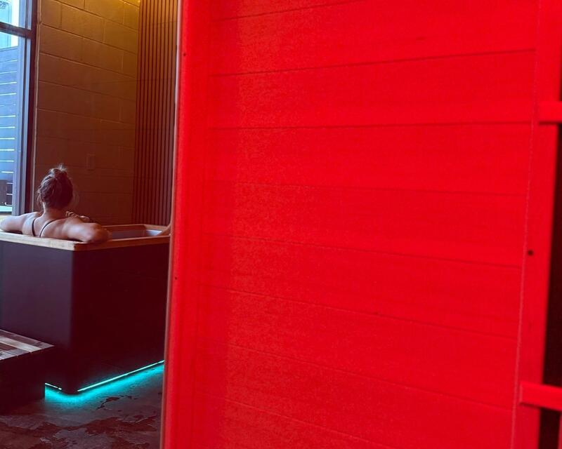 Woman in the cold plunge at Flowstate Oasis